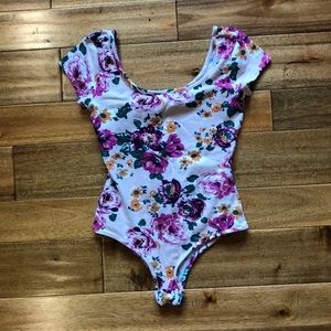 Short sleeved pink leotard with flowers